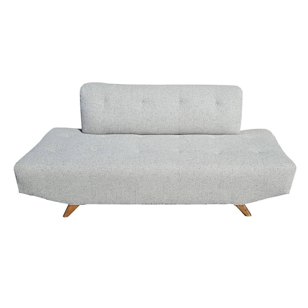 Vintage Mid-Century daybed sofa is upholstered in a grey textured fabric. The back can be removed for a roomier sleeping area.