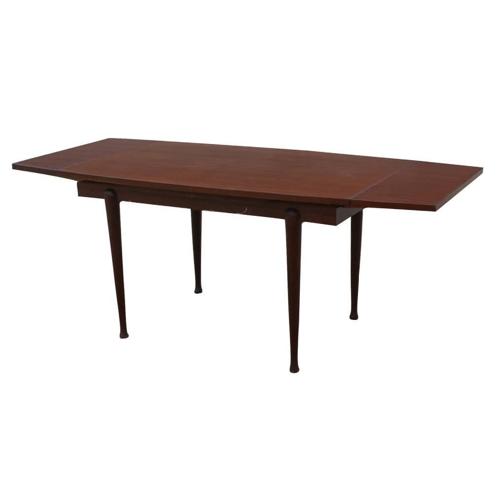 Vintage Danish mahogany dining extension table.
Mahogany construction.
Extension mechanism.
Tapered legs with ball feet.