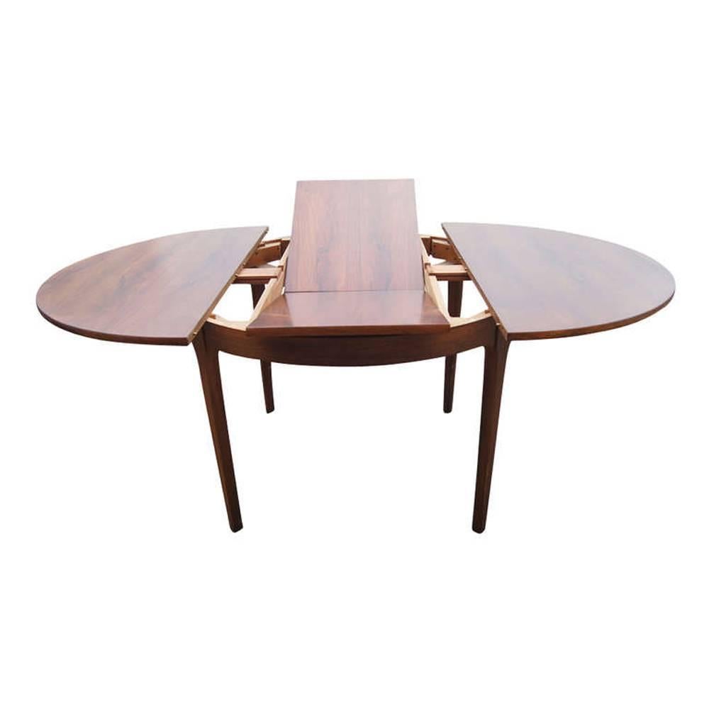 
48" round dining table, can be expended to oval 66" length.
Nice mechanism, beautiful teakwood with tapered legs.