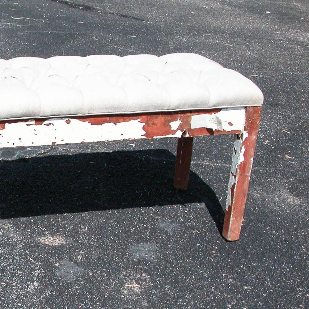 Vintage farm bench with upholstered top.

Shabby chic distressed bench with a tufted linen upholstery. Measures: 6ft.