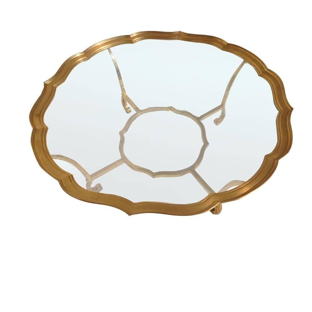 La Barge.
Italy.
 
A sister company of Maitland-Smith, La Barge manufactures
traditional European mirror and table designs.
 La Barge brass and glass coffee table.
 1960-1969.
#8111.
 
Vintage Hollywood Regency French Provincial brass