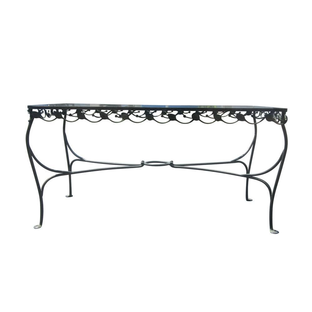 A vintage wrought iron glass dining table with a leaf pattern designed by Salterini. 

Inquire about matching chairs

Measures: Width 60.5" x depth 32" x height 30"


  