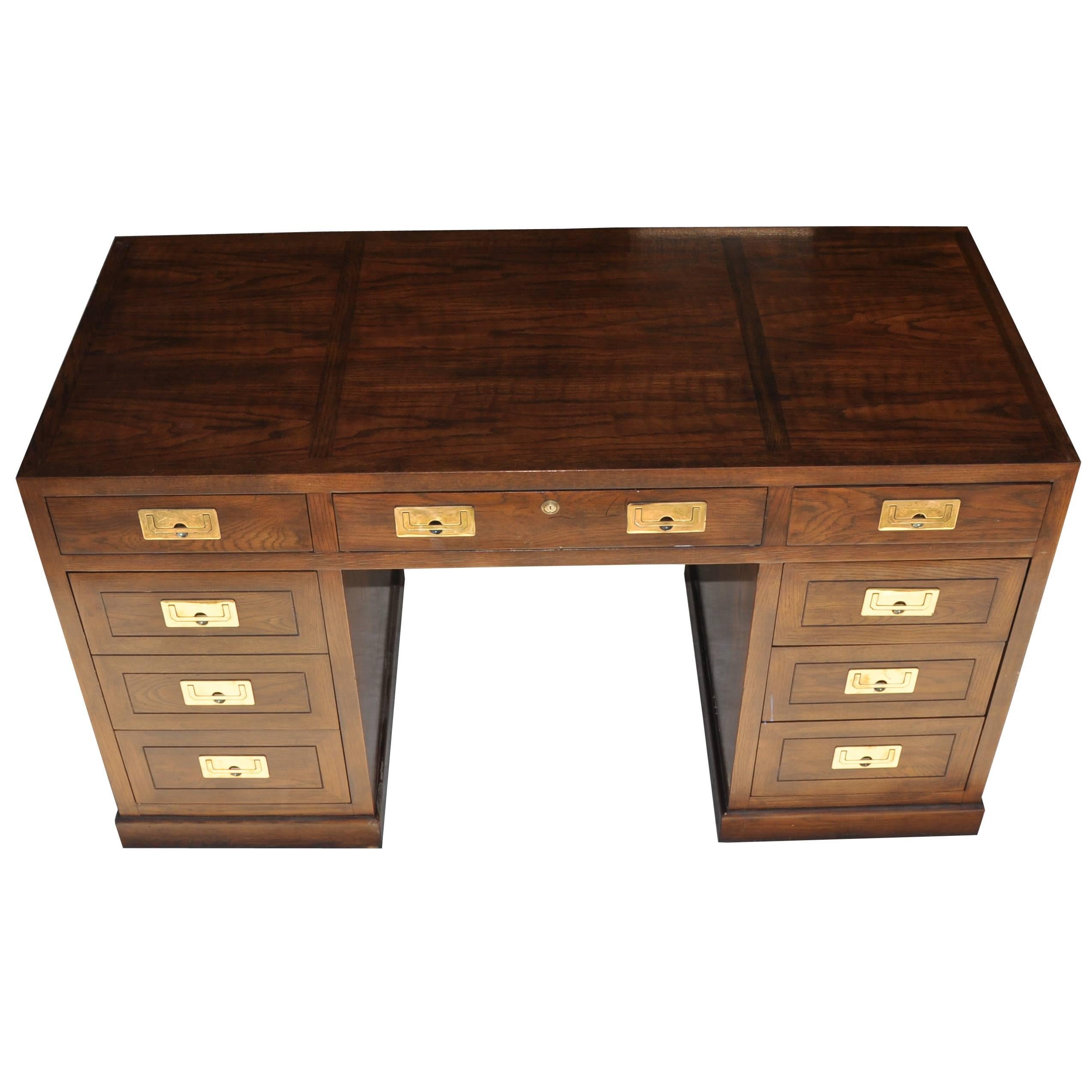 Mid-Century Modern Campaign style desk with brass pulls by Henredon 


Mid-Century Modern Campaign desk made by Henredon with a fruitwood finish and dove tail construction. Finished on all sides with brass hardware. Eight drawers including one file