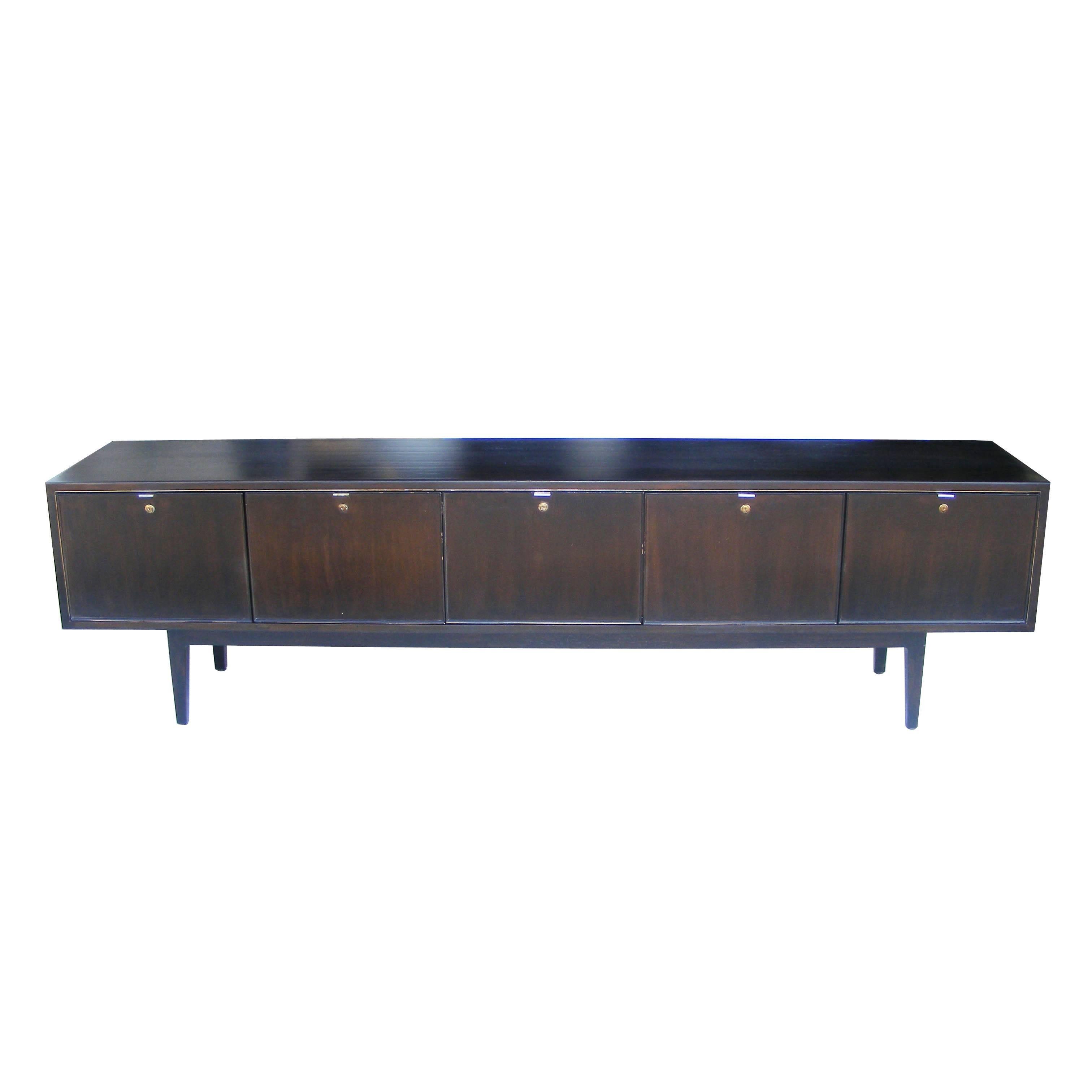 8ft vintage Stow Davis solid walnut credenza 

Light ebony finish 
Chrome handle pulls 


(Four) file drawers 
(One) pull-down door in the middle with adjustable shelf 
Tapered legs.