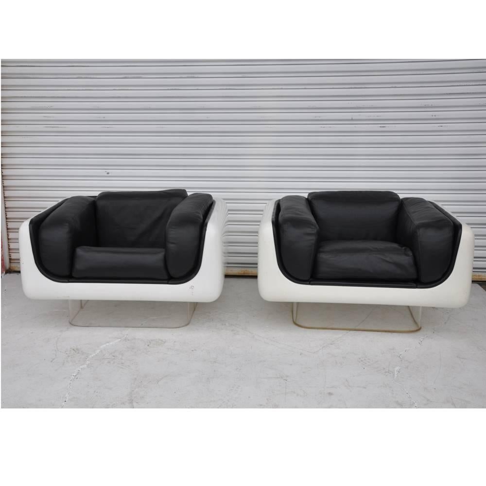 Pair of Steelcase lounge chairs, William Andrus 

The Soft Seating Line was introduced in May 1972. Each piece is mounted on clear acrylic bases. The seats are designed to give firm back support and soft comfort to the body`s contours. 

These