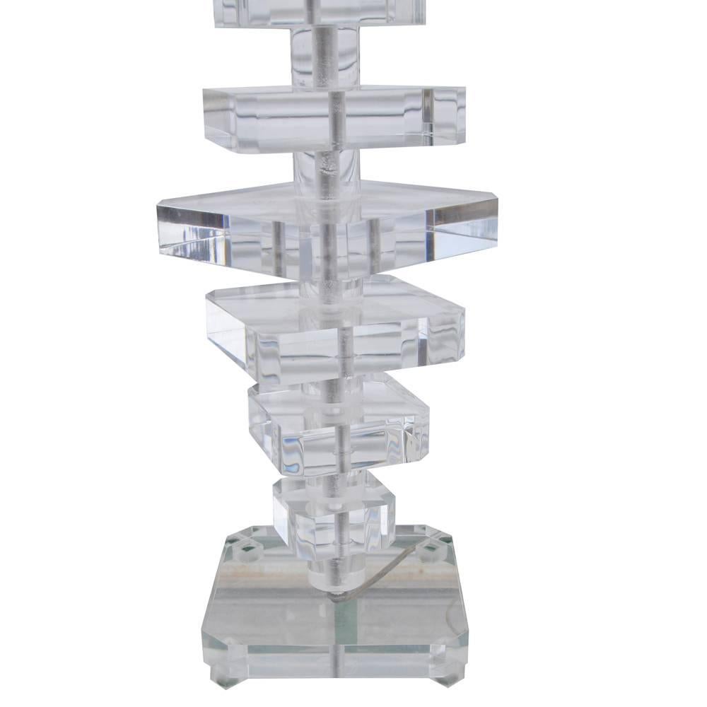 Karl Springer style Mid-Century Modern stacked Lucite table lamp
 
This modern lamp with stacked Lucite blocks, encased in a chrome cylinder mounted on flat base. 

Measure: 6.75 x 5.75 x 35" H

Very good.

 
