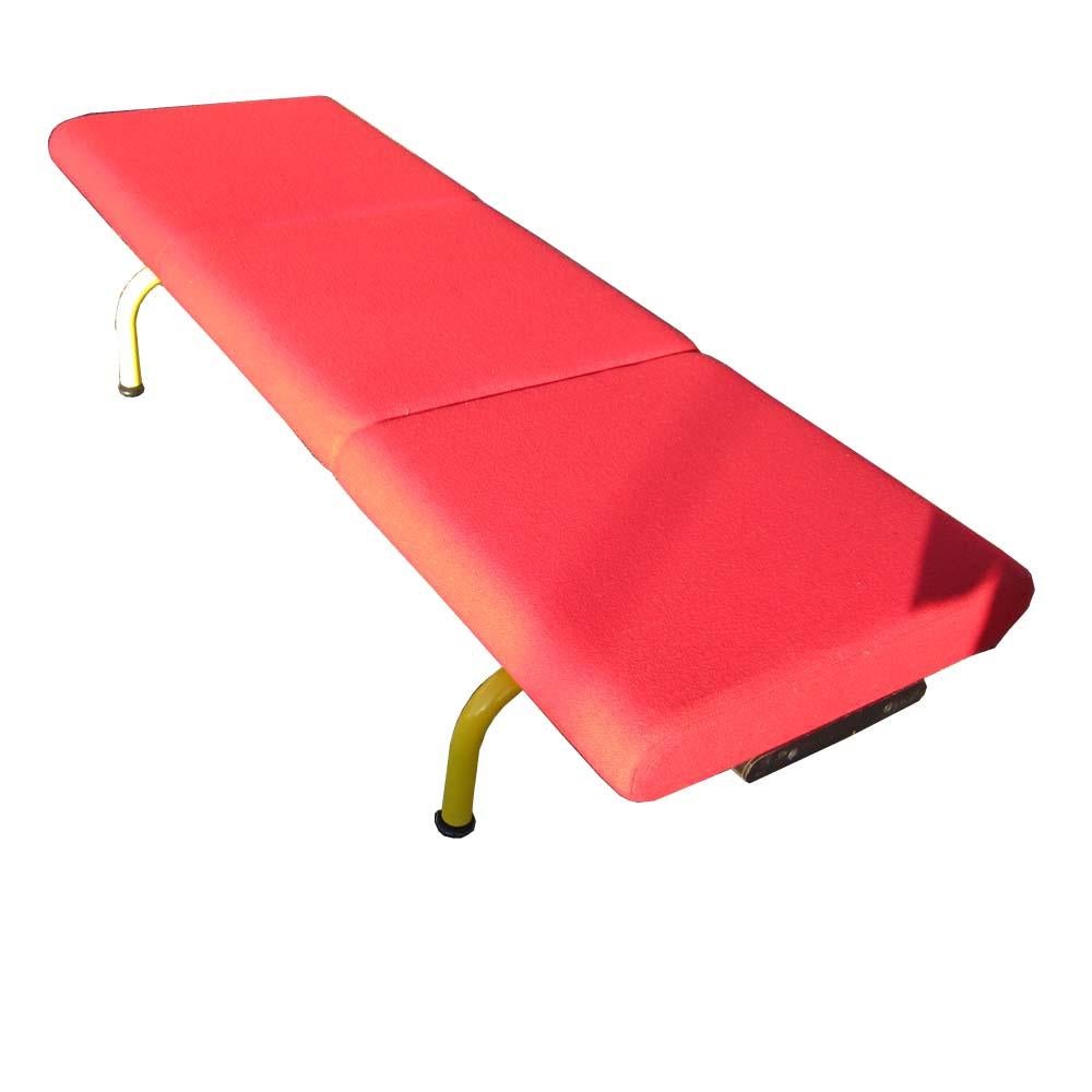 Stunning, red fabric Pipeline Bench by Erik Jorgensen Mobelfabrik. The base is stainless steel and is finished in a RAL1018 Zinc Yellow powder coat.