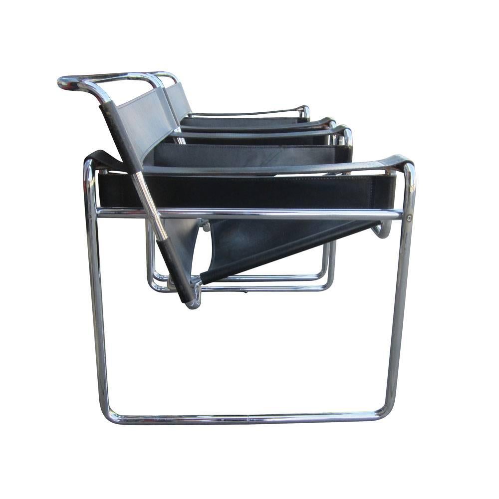 A pair of Black Leather Wassily Chairs by Marcel Breuer for Gordon International. This is the most copied of all Breuer's chairs. The frame was originally made from bent, nickelled, tubular steel. It later became chrome plated. The seat and the back