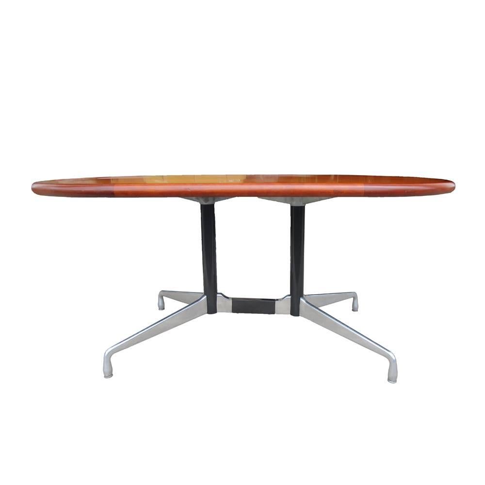 A vintage dining or conference table or a desk. Beautiful Knoll top made of American Walnut on a Herman Miller aluminum segmented base. We have 8 available.
 