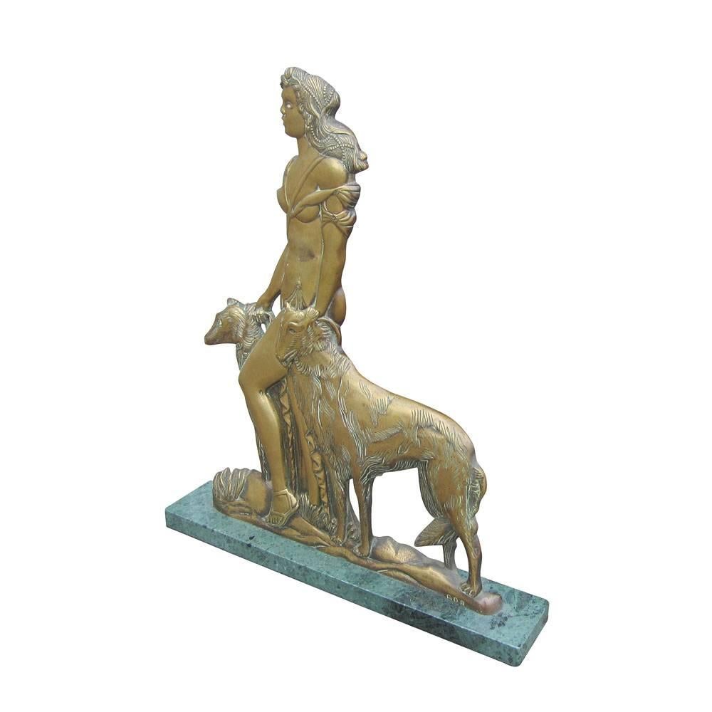 Vintage bronze woman statue with marble base. This is a bronze sculpture depicting a young woman and her two dogs also known as Artemis in Greek mythology. It has a light patina and marble base, signed ada. A good example of bronze sculpture
