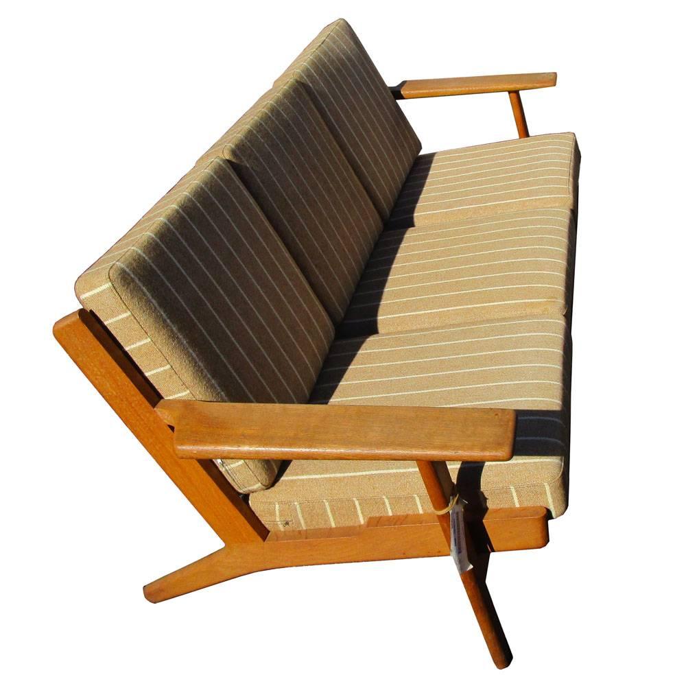 Hans Wegner GE 290 3 Seat Sofa for Getama
Designed in 1953

Solid Oak frame with original striped upholstery 

Made in Denmark

Matching armchair and lounge chair with ottoman as shown in picture 5  