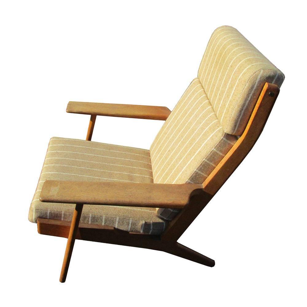 Danish Original Upholstery Hans Wegner Lounge Chair with Ottoman for Getama