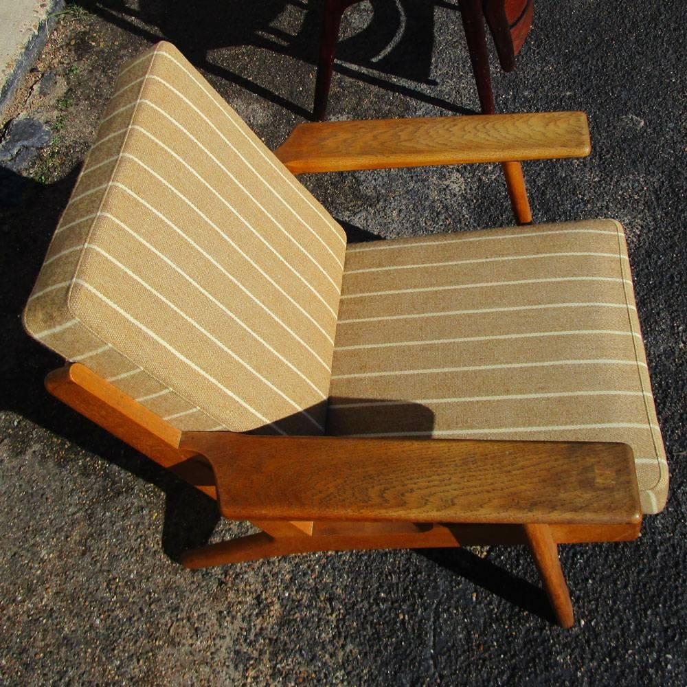 Vintage mid century Hans Wegner Armchair for Getama 
Solid Oak frame with tan stripe upholstery 
Made in Denmark
Matching lounge chair with ottoman and matching sofa shown in picture 3 available
