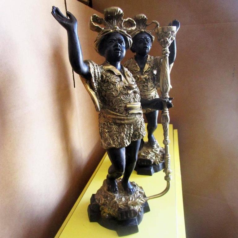 Vintage Blackamoor cast bronze pair of candle holders For Sale at 1stdibs