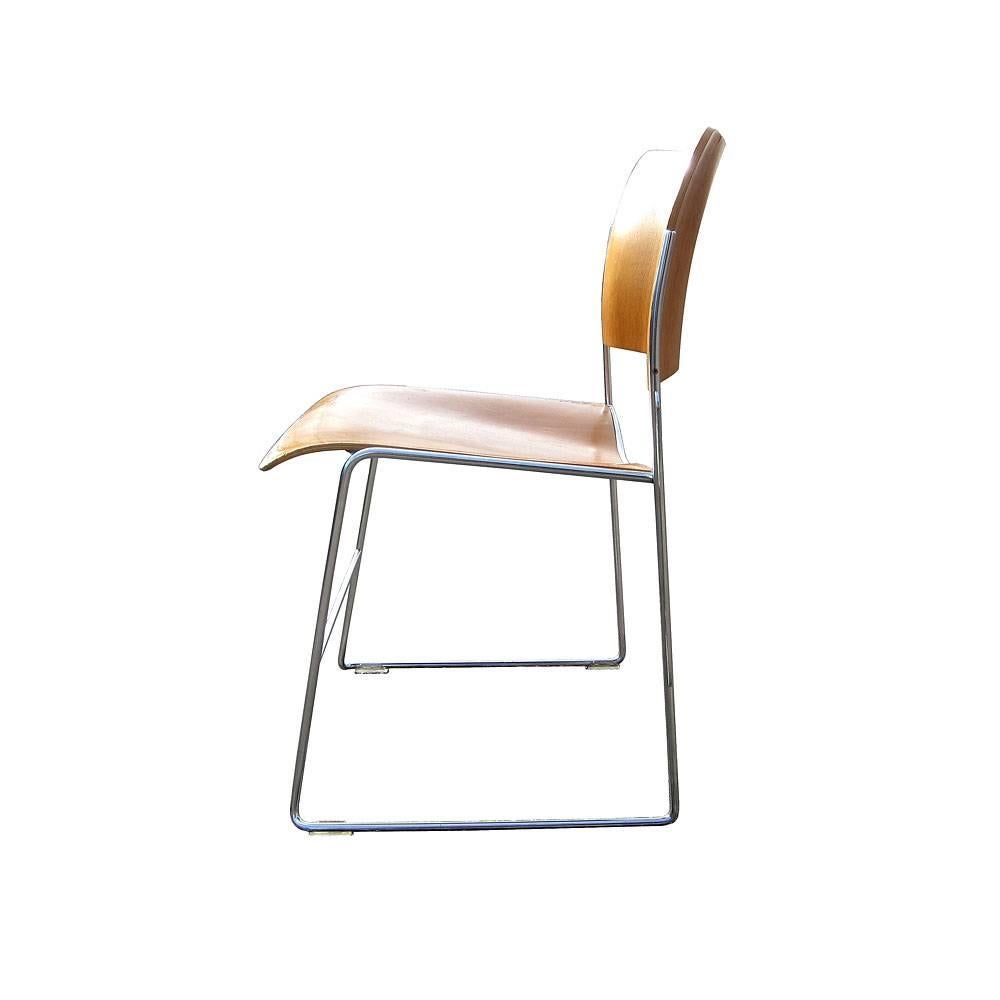 Vintage Eames era GF Rowland 40/4 stacking chair. Beech-faced molded plywood seat and back with chromed steel rod frame. These chairs were designed as a solution for flexible, stackable seating and executed with a graphic sleekness. 40 chairs can be