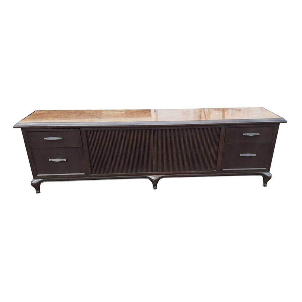 Monteverdi & Young.

Maurice Bailey.

Monteverdi-Young executive credenza or sideboard with two tambour doors and four drawers in walnut with a vivid burl top. Likely designed by Maurice Bailey, this sumptuous long credenza has a matching desk