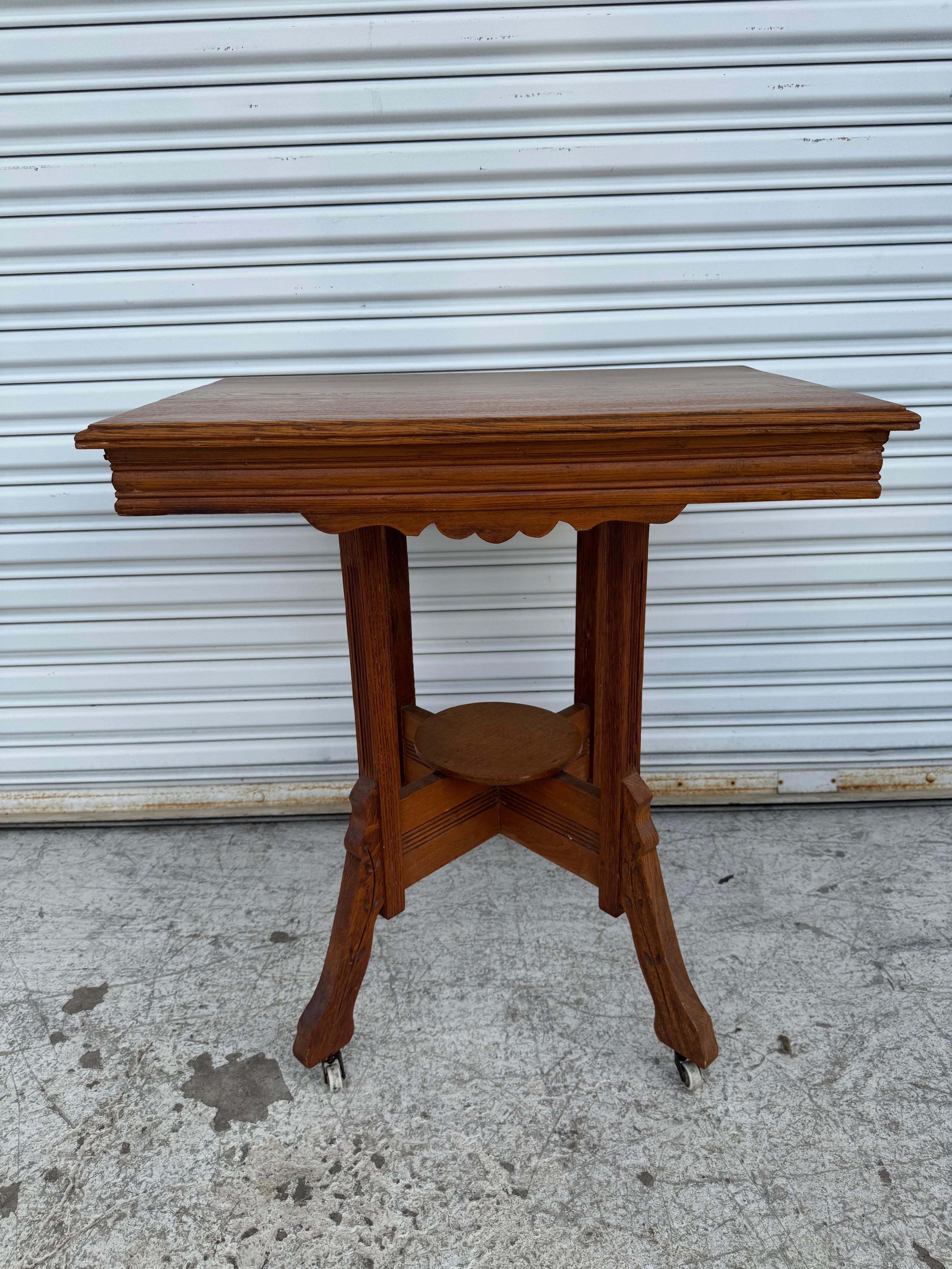 Beautiful antique walnut table designed by Charles Eastlake. Very nice original finish. Has original porcelain casters.
Dimensions: 
Length: 28