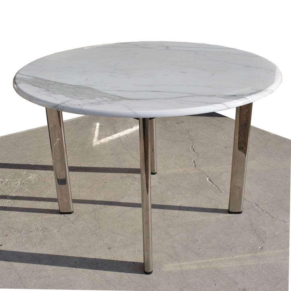 A mid century modern table designed by Joe D'Urso and made by Knoll which could be used for dining or as a task/work table.  A round carrara marble top and chrome legs.