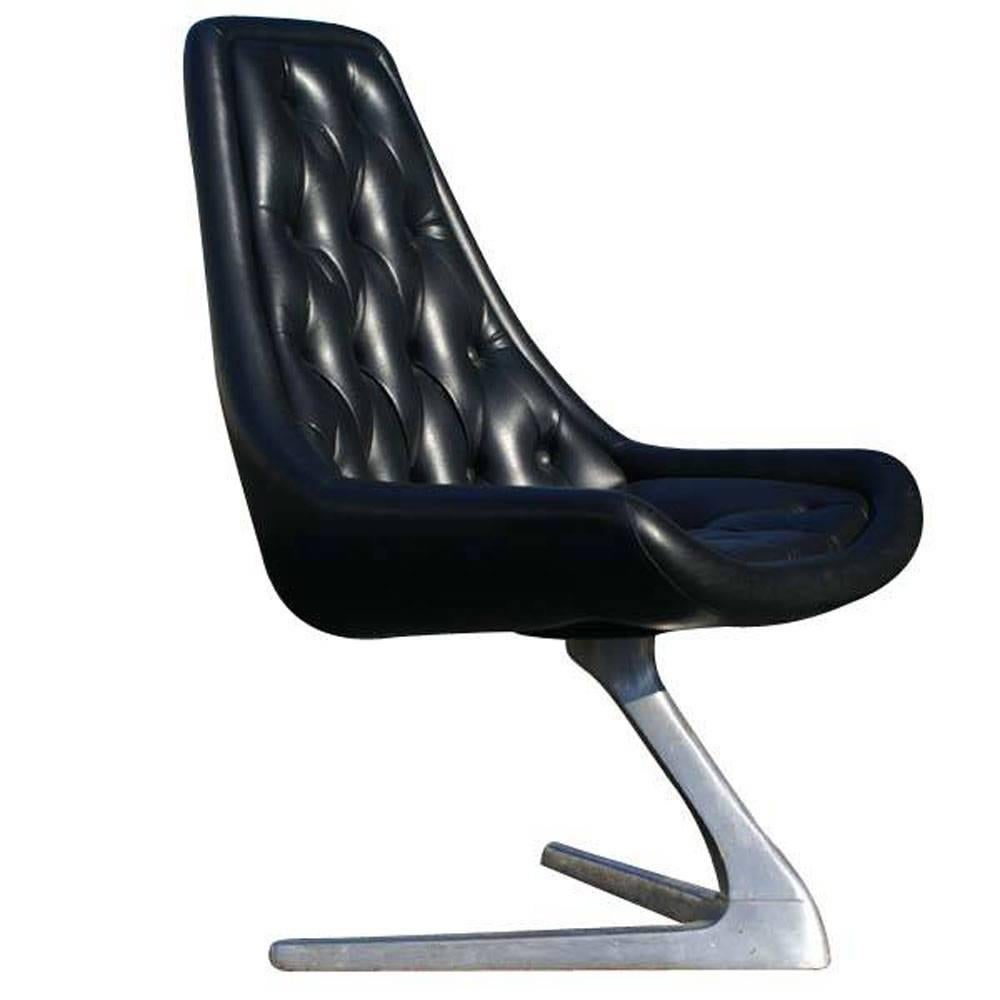 Chromcraft chromcraft sculpta unicorn chair V-shaped base.
 7 available.
Features
Polished aluminum swivel base.
Tufted black vinyl upholstery. 
Reupholstery recommended and can be done for an additional fee.
 
Historical footnote: They were in two