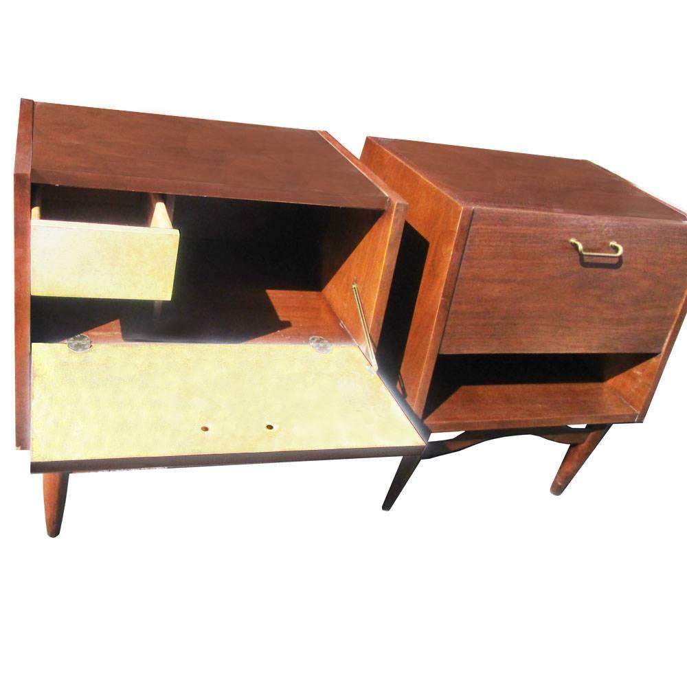 Merton Gershun for American of Martinsville walnut nightstands, circa late 1950s.These nightstands have drop down doors with a good amount of space and solid walnut legs.