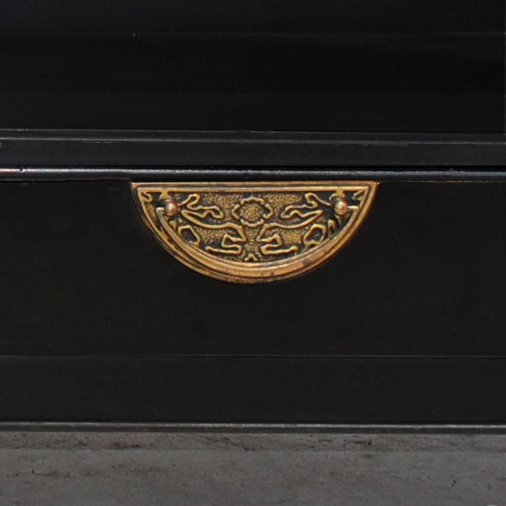 A pair of Asian inspired nightstands by Century Furniture.

Ebonized with brass pulls on drawer at bottom. Ample open area above for storage and books.

 
