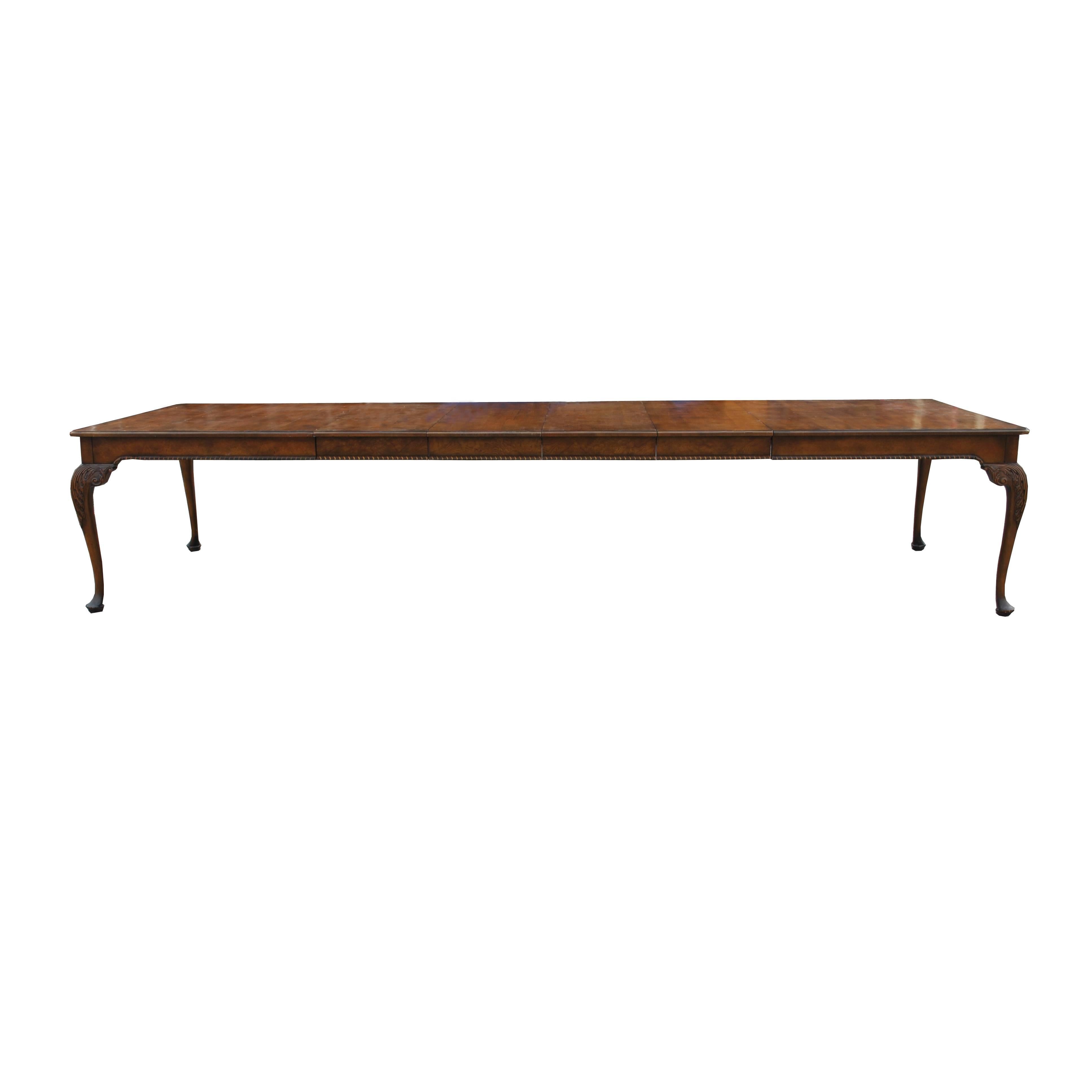 Queen Anne style 12ft dining conference table
From the baker furniture stately homes collection

Stunning walnut dining table, rounded
rectangular hand planed top with molded and crossbanded borders with ornate cabriole legs.
Four leaves