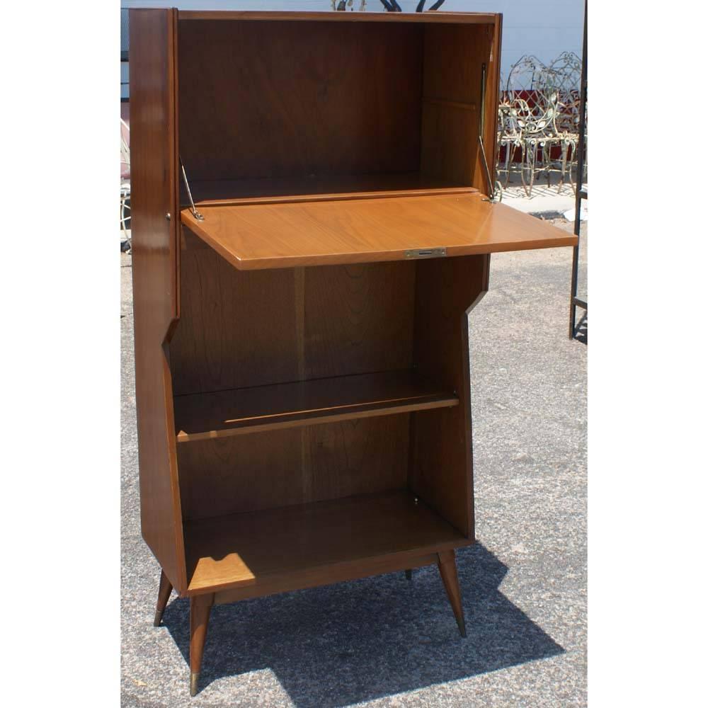 Danish Modern Walnut Secretary Standing Desk 

Pull down cabinet that can serve as standing desk 
One shelf 
Four solid walnut tapered legs