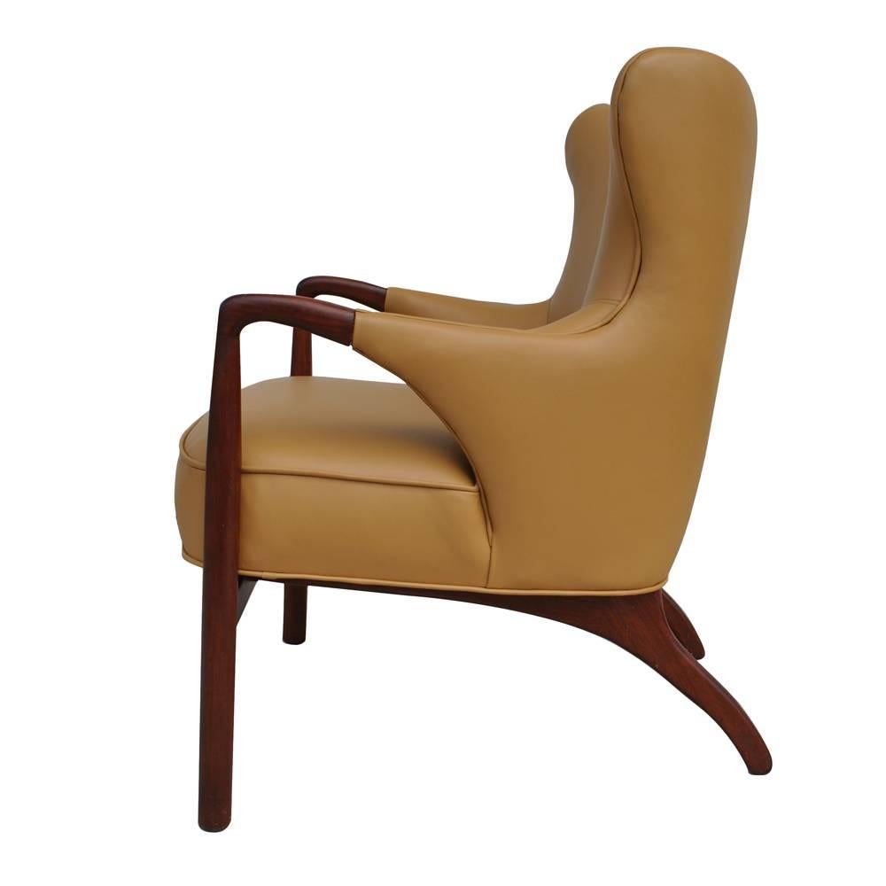 Vintage midcentury lounge chair 

Beautifully curved wingback lounge chair. Restored in a rich tanned leather. 
 