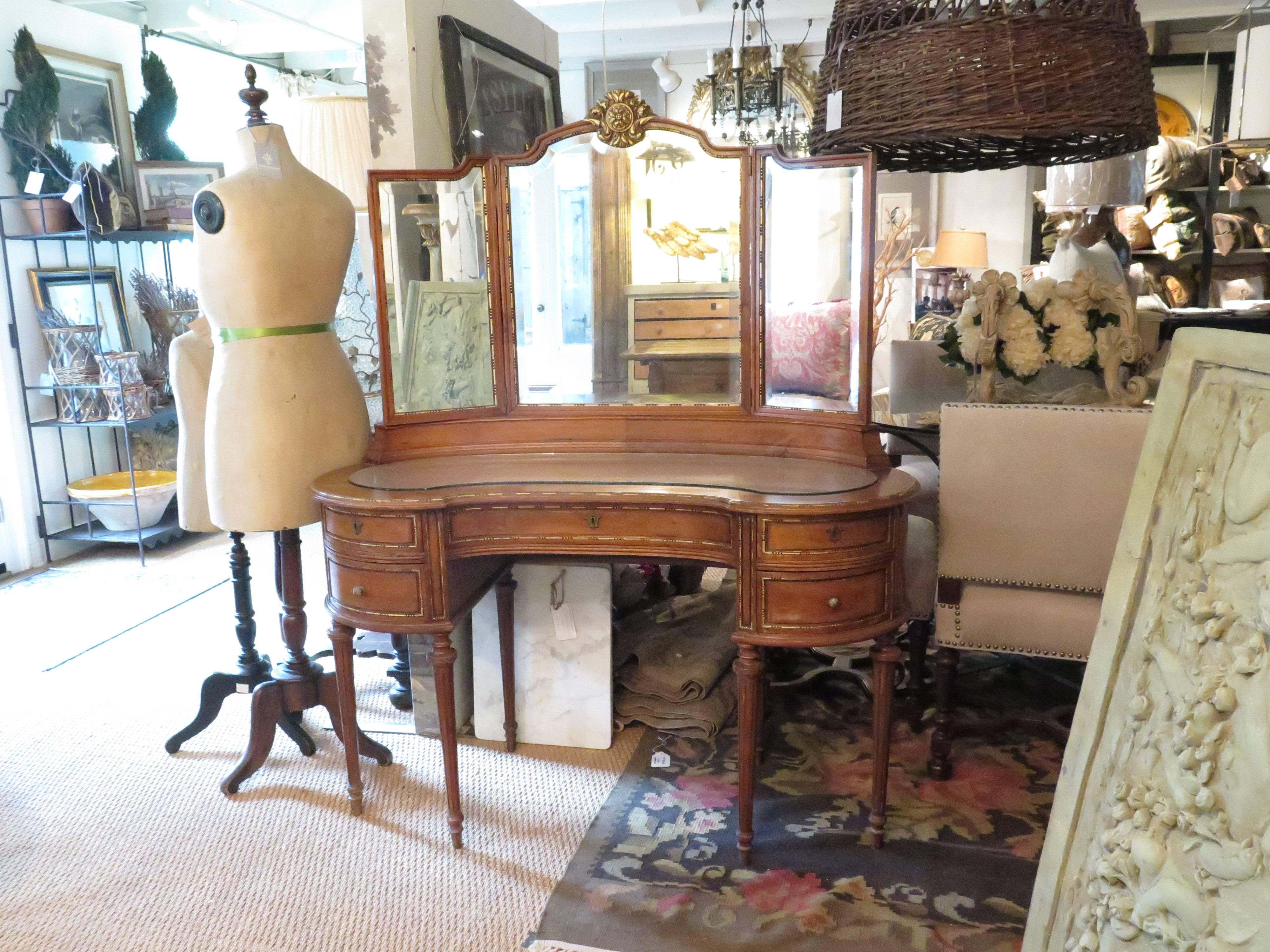 Louis XVI style parcel-gilt vanity with chair and beautiful carved parcel-gilt details in acanthus leaf motif. Table height is 29.5". Chair has minor damage on back caning.