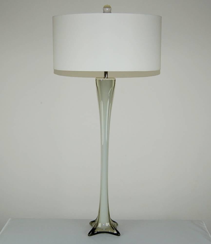 Towering four-sided column lamps of taupe, with distinct ribs. From the four-point feet to the free-form top, these lamps present an elegant Silhouette. 

They stand 34 inches from tabletop to socket top. As shown, the top of shade is 39 inches