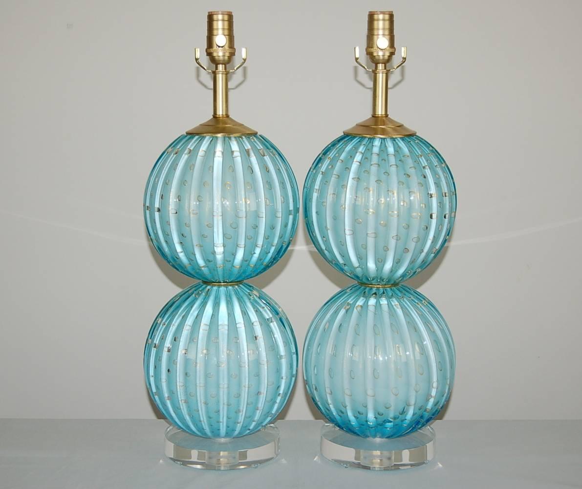 Pair of stacked ball Murano table lamps in ROBIN'S EGG BLUE - soft and magical, with such depth. Defined ribs, and controlled bubbles rimmed in GOLD!

They stand 22 inches from tabletop to socket top. As shown, the top of shade is 28 inches high.