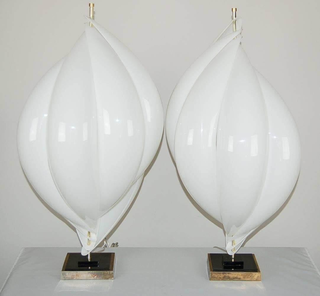 Wonderful matched pair of vintage Rougier lamps from the 1970s. The huge petals are of WHITE acrylic - in perfect condition. The brass facing of the base shows some wear. Both bases retain the Rougier label.

The lamps are 36 inches high from table