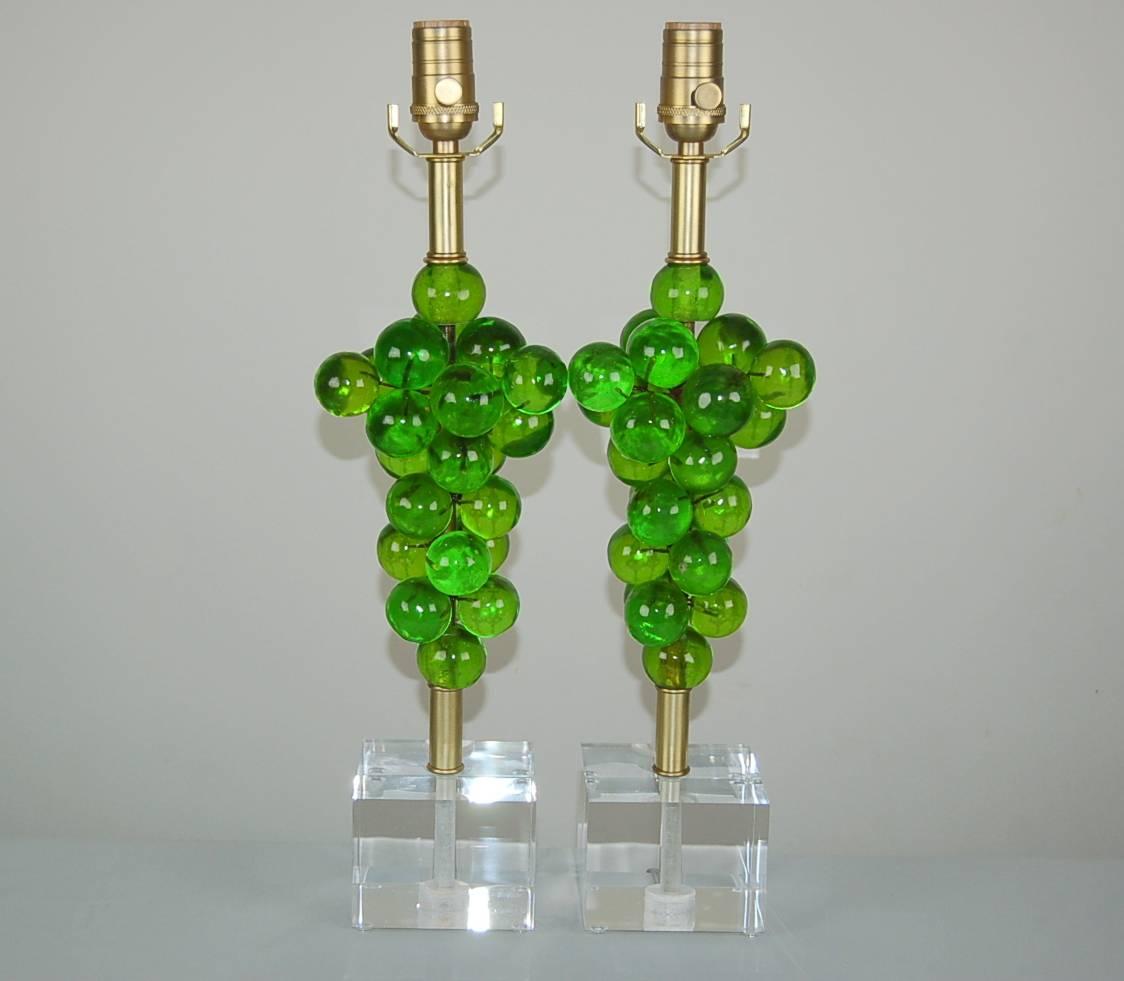 Matched pair of vintage resin table lamps. Such beautiful sculptures in wonderful shades of LIME GREEN. These Bubble lamps were created by Silvano Pantani and imported from Italy, in 1966. 

These limited edition lamps are 20 inches from tabletop to