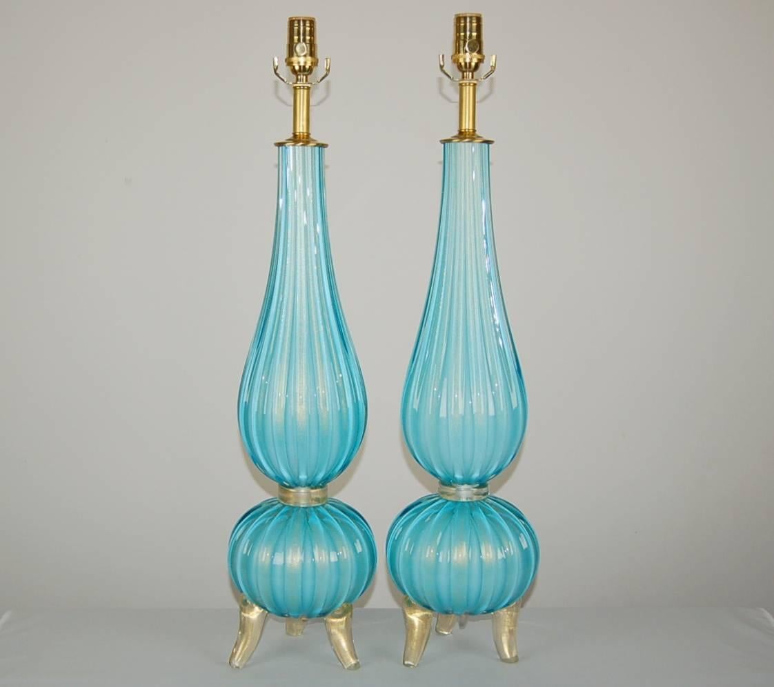 Matched pair of the Classic three footed table lamps. Breathtaking ROBIN'S EGG BLUE filled with GOLD dust.

They measure 31 inches from tabletop to socket top. As shown, the top of shade is 37 inches high. Lampshades are for display only and not