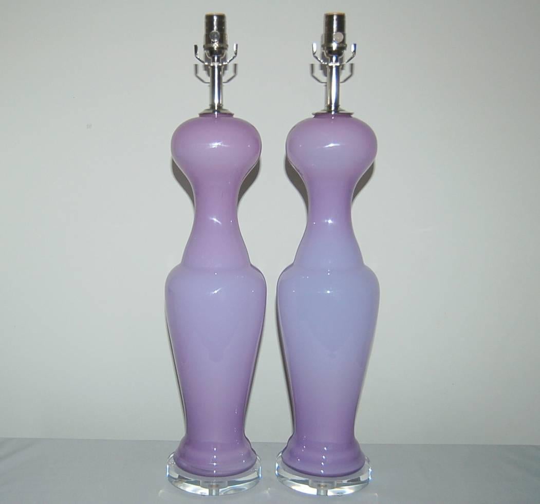 Vintage Murano matched pair of magical opaline glass in LAVENDER ORCHID. Statuesque and curvy shows out beautifully on Lucite base. 

These lamps measure nearly 29 inches to the top of the socket. As shown, the top of shade is 33 inches high.