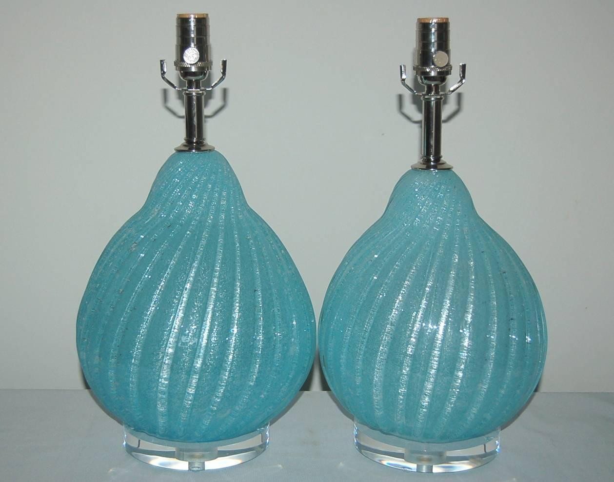 Organic shaped gourds of AQUA BLUE Pulegoso, with thousands of tiny air bubbles blown within the glass. The visual texture and color are breathtaking! Our only pair. 

They stand 18 inches from tabletop to socket top. As shown, the top of shade is