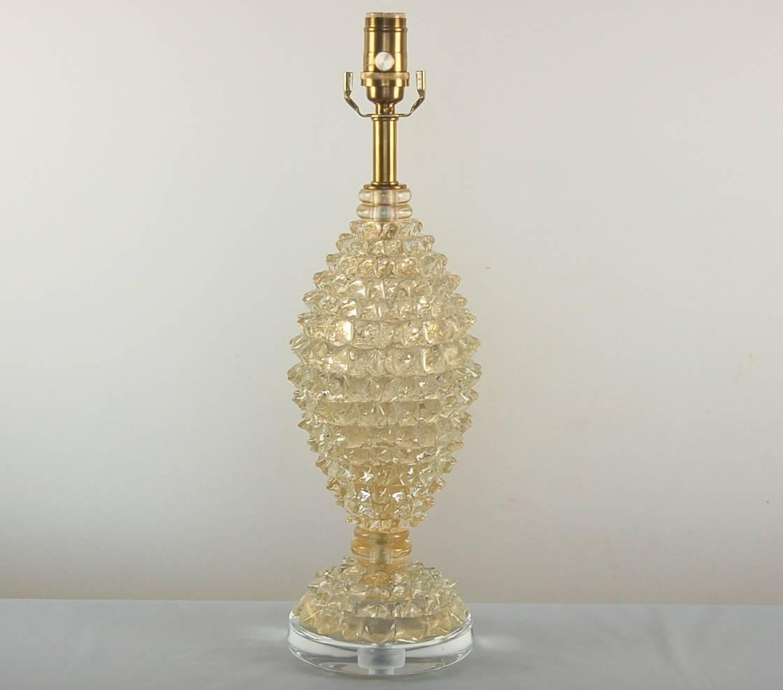 Vintage Murano glass table lamp by Barovier et Toso in CHAMPAGNE GOLD. Concentrically ringed glass nubs, loaded with gold inclusions. 

It stands nearly 21 inches from tabletop to socket top. As shown, the top of shade is 25 inches high. Lampshade