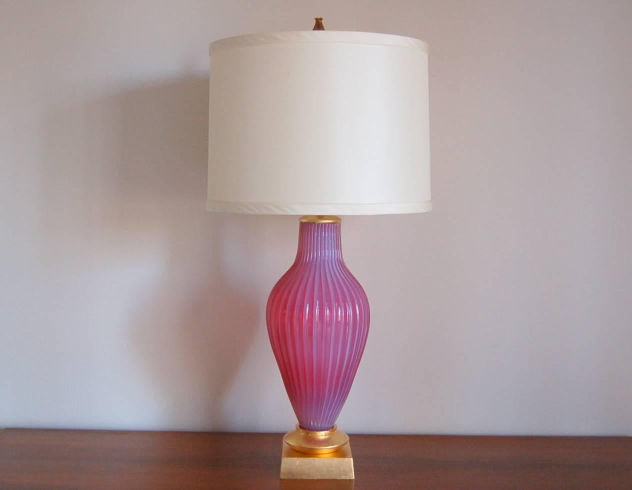 Perfectly matched pair of vintage Murano table lamps by Seguso for Marbro. Exquisite Murano opaline lamps in RASPBERRY PINK by The Marbro lamp company on glamorous Gold leafed bases. An enormous pop of candy color that glows in natural light,