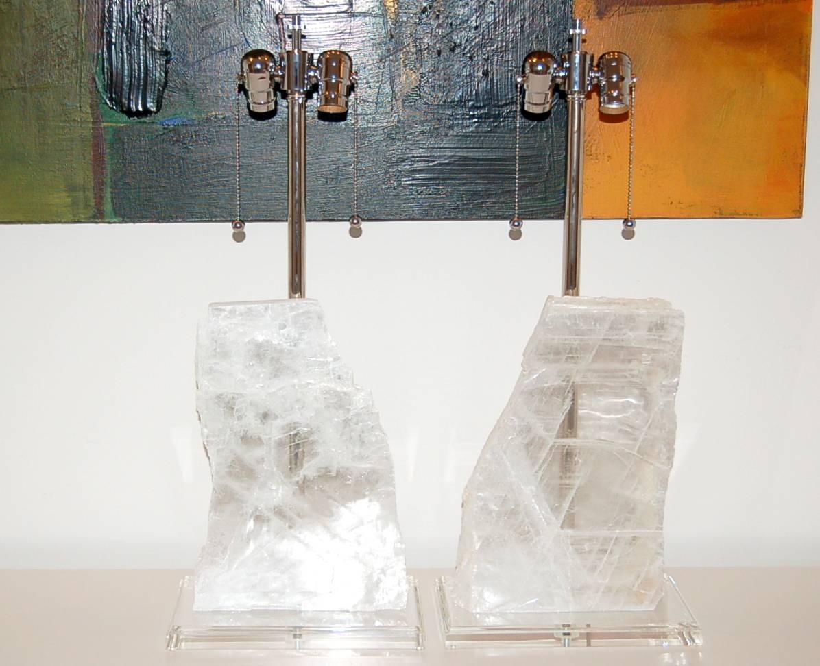 Natural WHITE SELENITE stone table lamps by Swank Lighting. These look like two sheets of glacial ice. Great visual texture and clarity to each selenite sheet. 

The base of each lamp is 11 inches wide and 7 inches deep. The selenite pieces are 13.5