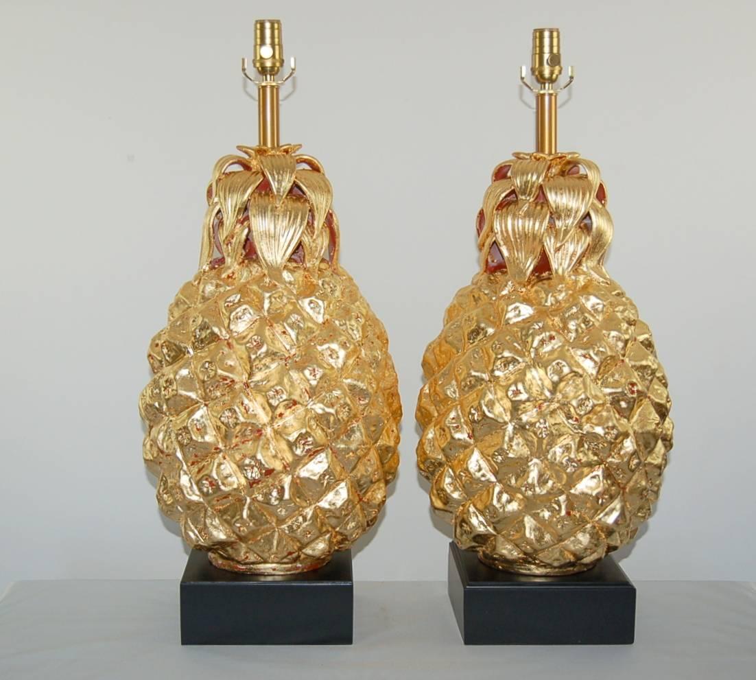 Matched pair of vintage Italian ceramic pineapple table lamps from The Marbro Lamp Company, covered in GOLD LEAF.

They measure 29 inches from tabletop to socket top. As shown, the top of shade is 36 inches high. Lampshades are for display only and