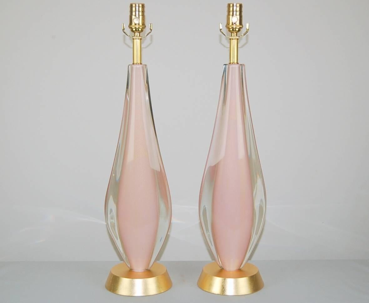 Matched pair of rare and elegant vintage Murano Sommerso Table lamps. A towering chunk of PALE PINK Murano glass dusted with GOLD, enveloped by a thick layer of clear glass. Such depth to each almond-shaped piece, thanks to the Sommerso