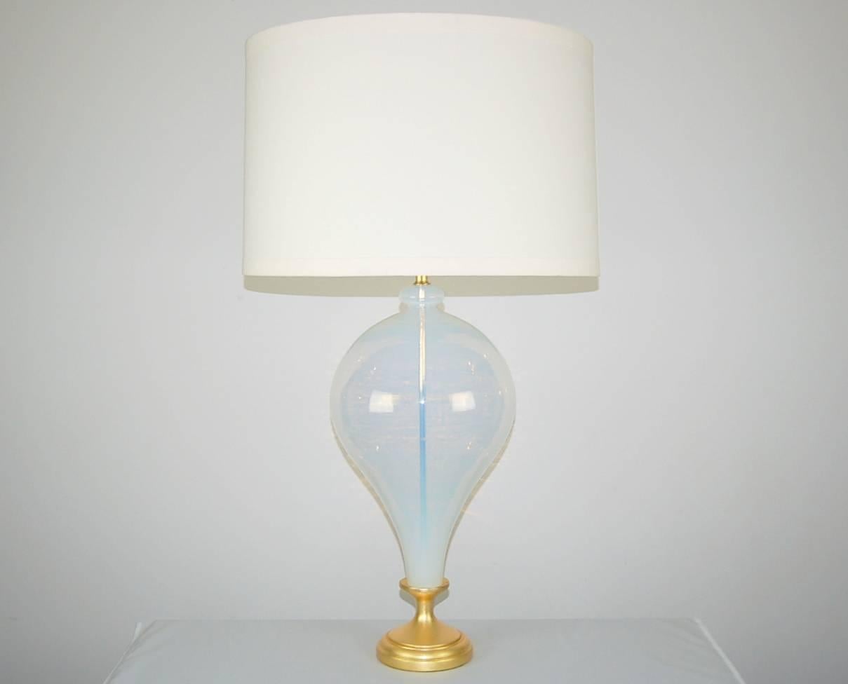 Enormous vintage Murano glass table lamp of WHITE OPALINE by The Marbro Lamp Company. As true of the best quality opaline, there is a slight PALE BLUE cast to the glass. Curvaceous with a thick glass top knot, a very sexy lamp!

The lamp stands 29