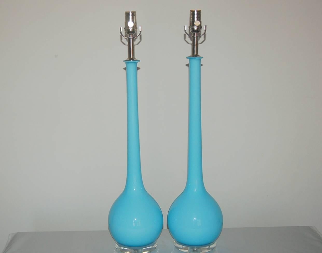 Vintage pair of sleek Murano long neck table lamps in SKY BLUE by Archimede Seguso. Our best sellers due to their sleek, sexy lines. Available in various colors - call for more info. 

The lamps measure 28 inches from tabletop to socket top. As