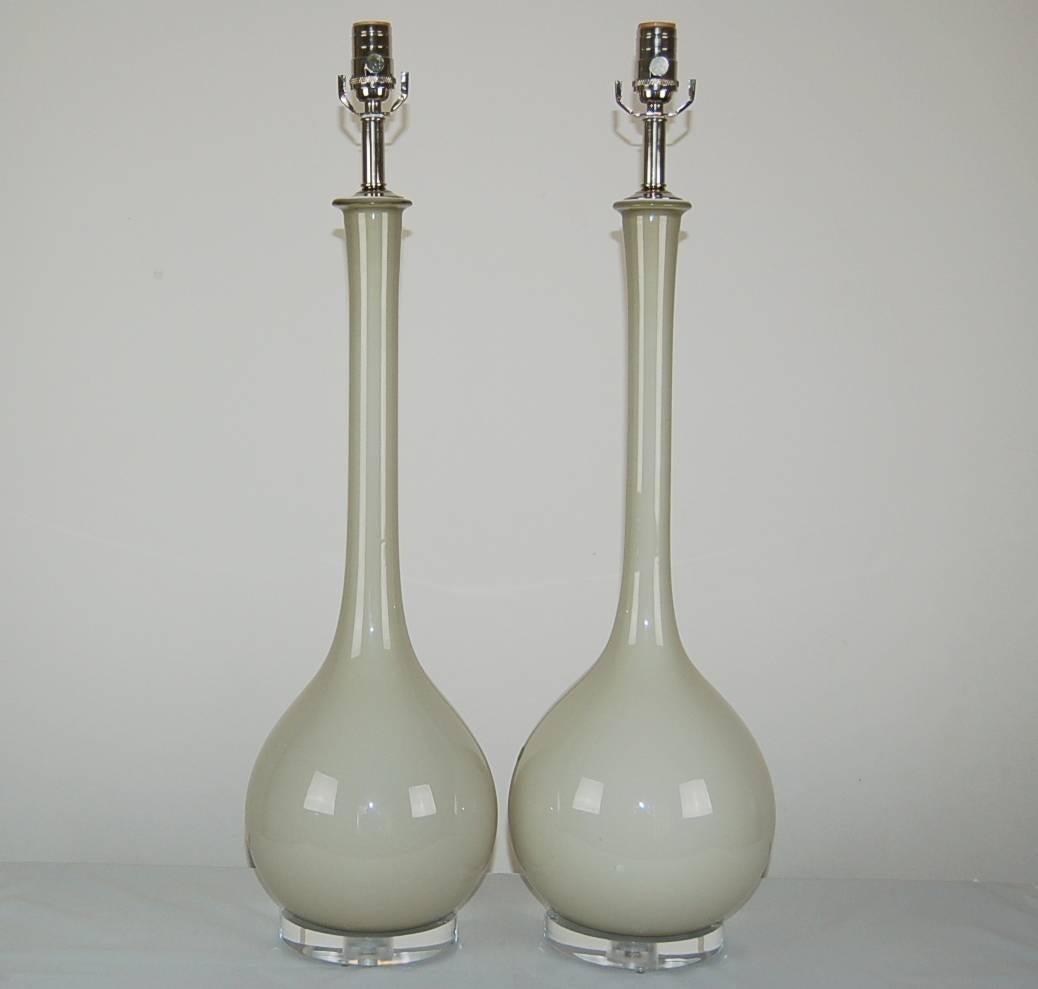 Matched pair of sleek vintage Murano Long Neck table lamps in DOVE GRAY by Archimede Seguso.  Shown with nickel-plated hardware. Long Necks available in other colors - call for details.  

The lamps measure 31 inches from tabletop to socket top. As