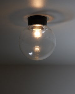 Lámpara de pared o de techo con esfera de cristal transparente y baquelita, década de los 70