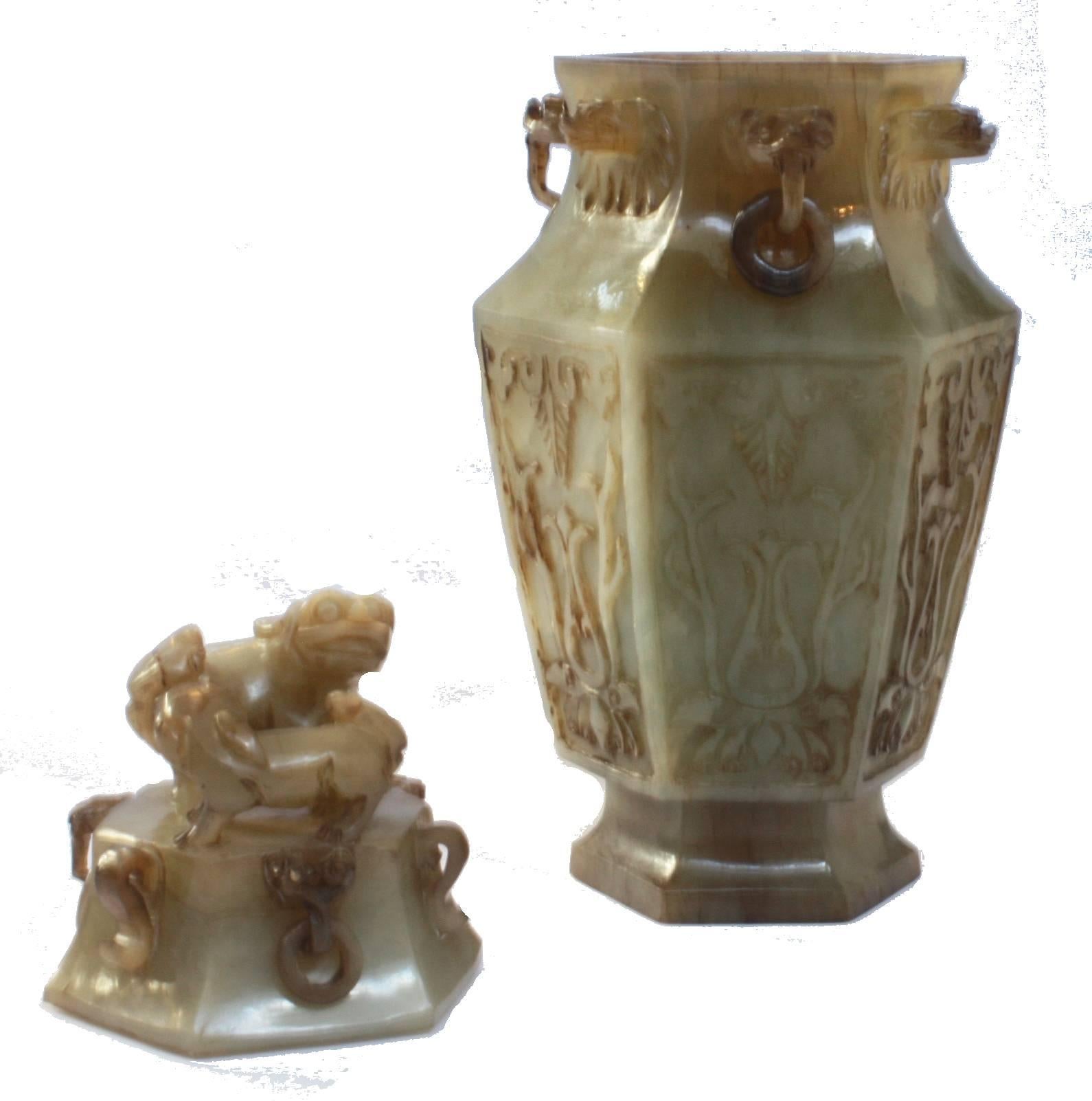 A Chinese green jade six-sided carved censer with dragon heads holding carved rings. Top has two standing foo dogs.