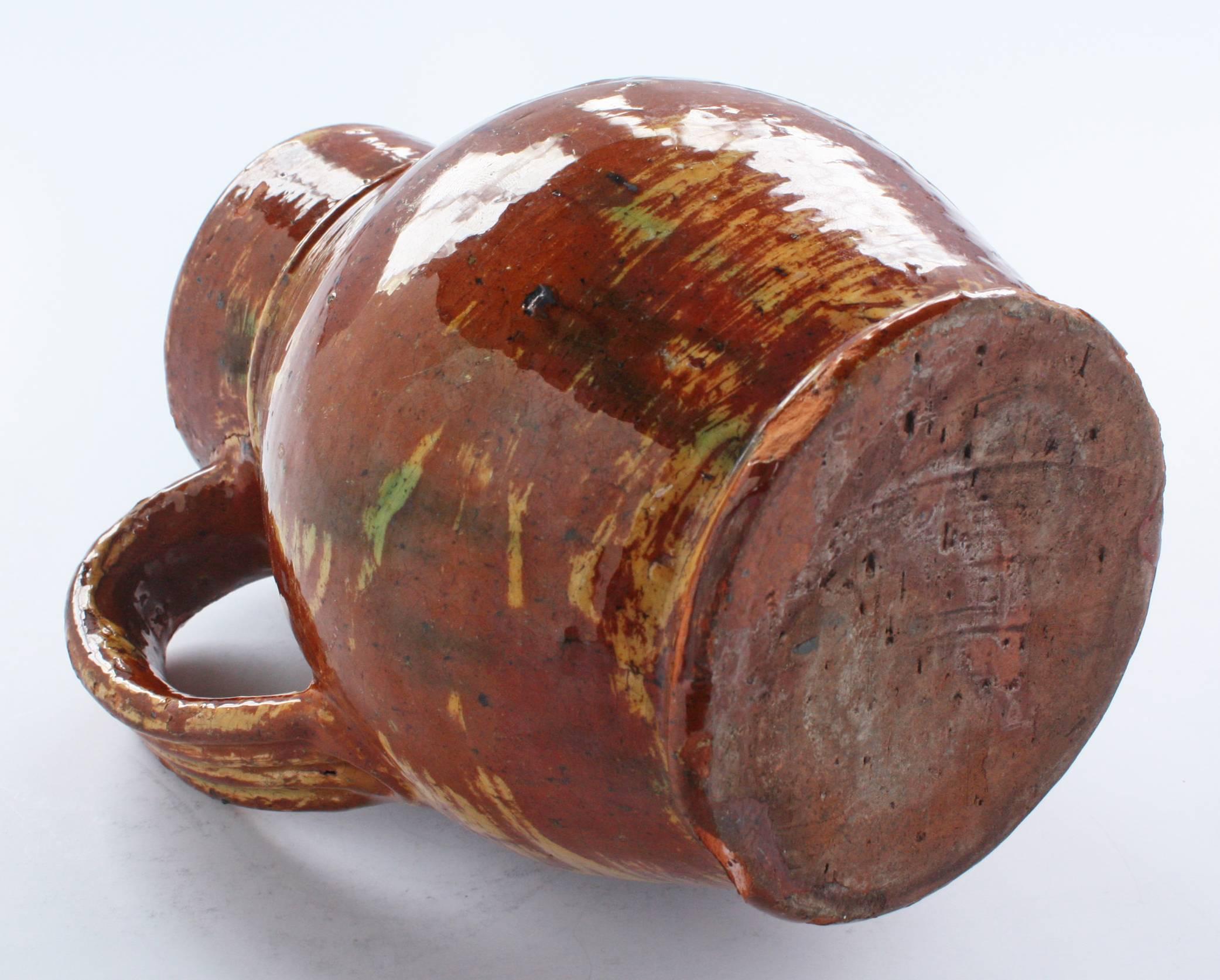 antique redware pitcher