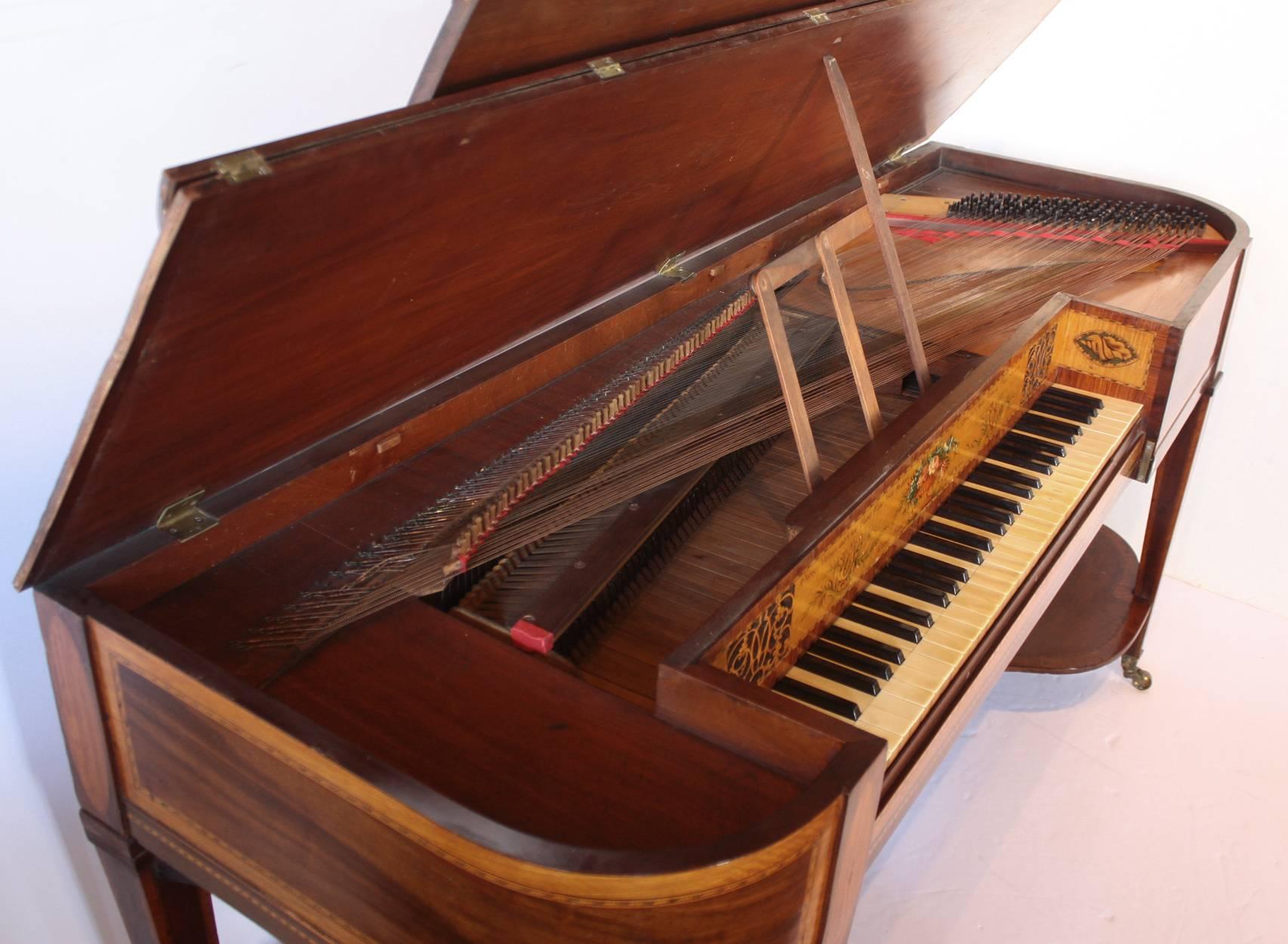 a Georgian square piano (with rounded front corners) on a 