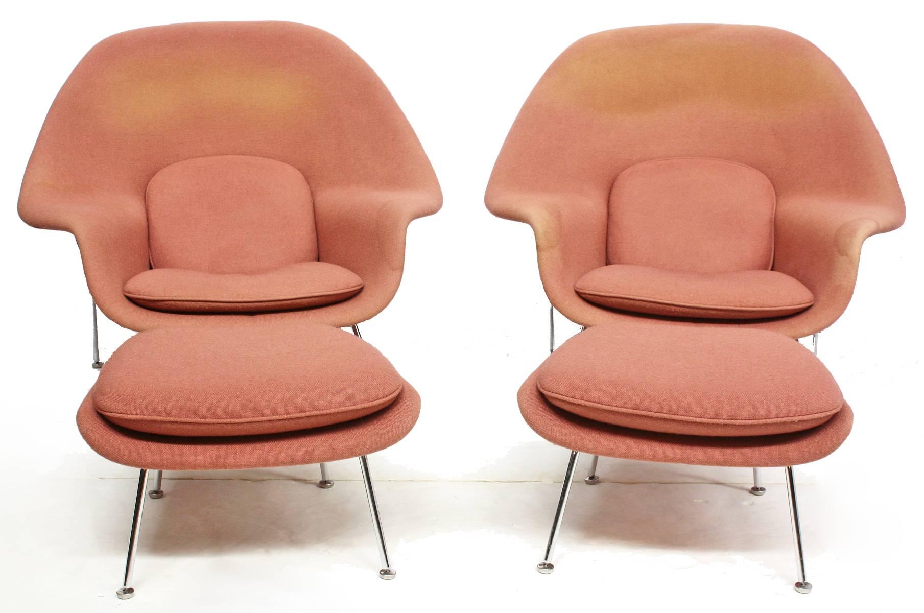 Pair of original womb chairs and ottomans designed by Eero Saarinen for Knoll. Chrome frame with original dusty rose upholstery. Knoll labels.

Ottoman dimensions: 15