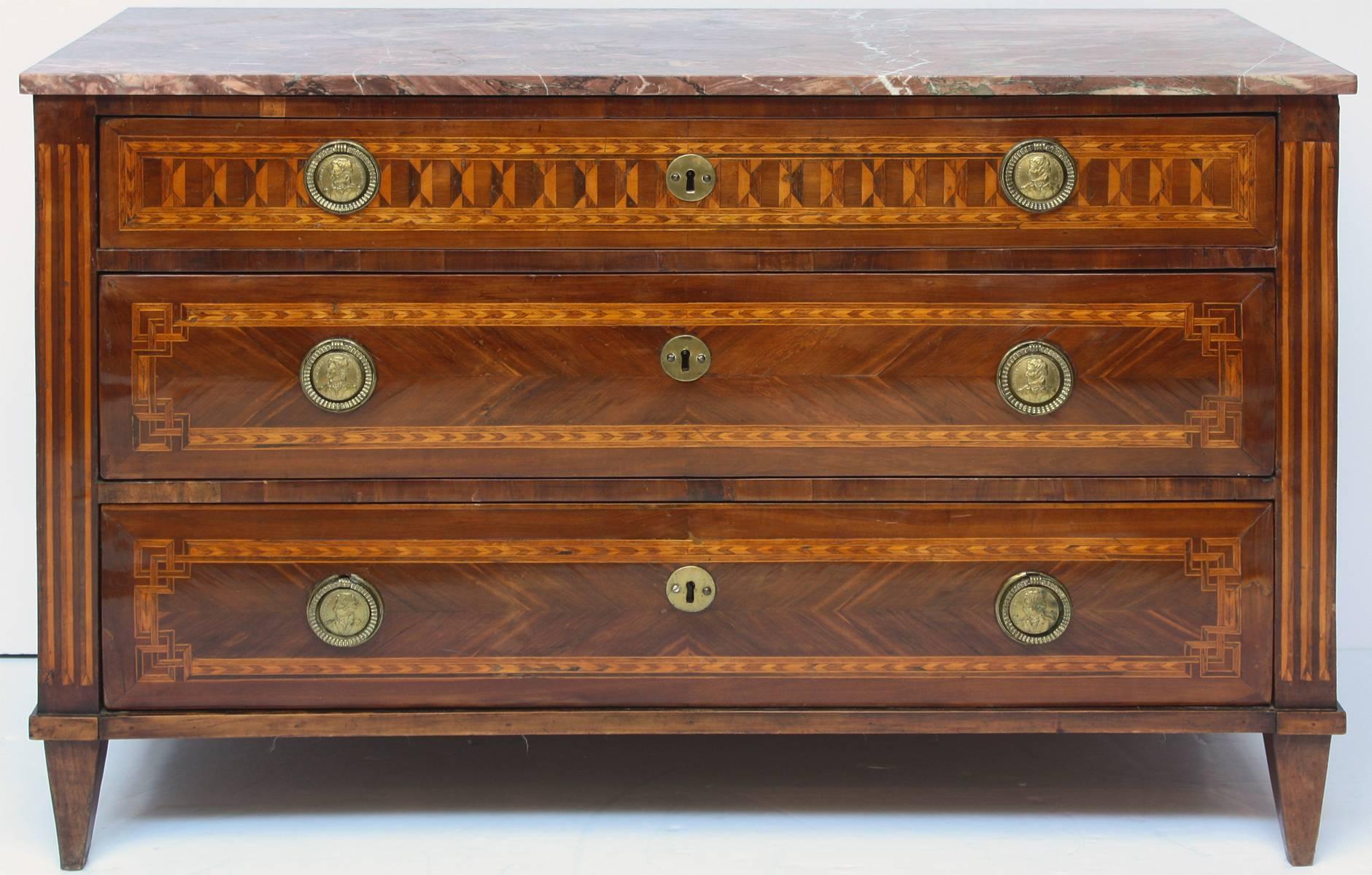 Neoclassical three-drawer chest with pulls depicting Napoleon. Fluted columns above square tapered feet.
 